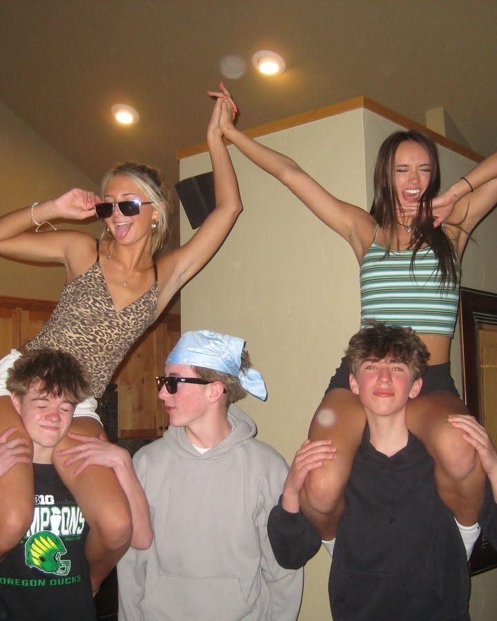 Friends on shoulders at a house party, before