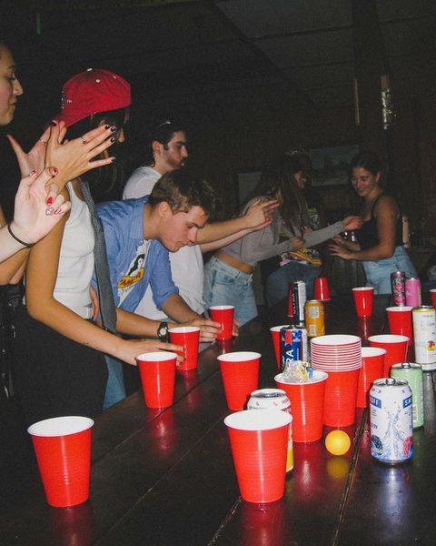 Red cups on a table at a house party, unedited